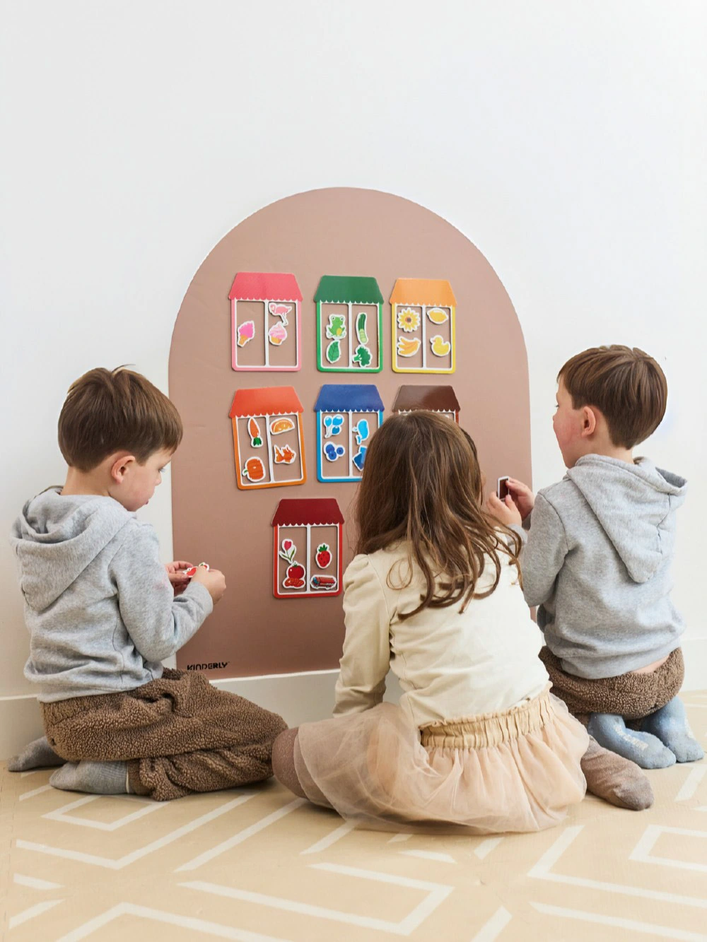 Child playing with Kinderly magnetic puzzle pieces